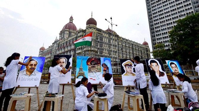 Children paint tribute for the Mumbai attacks on the 10th anniversary. (PTI)