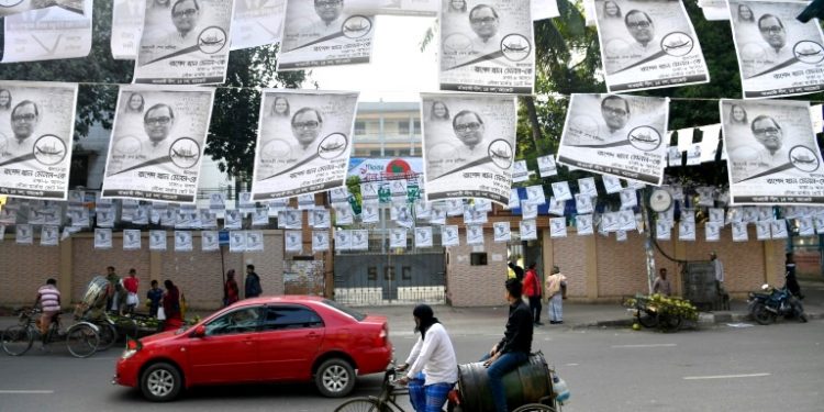 A street adorned with election posters in Dhaka December 28, 2018, ahead of the Dec 30 general election (AFP)