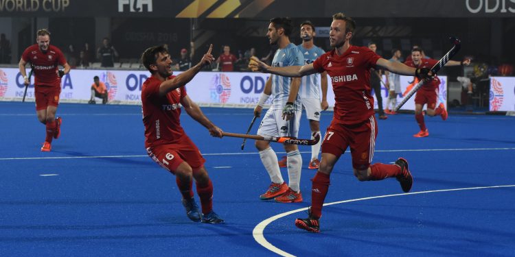 England players celebrate after one of their goals against Argentina at the Kalinga Stadium