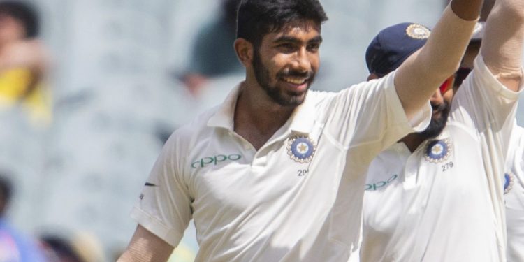 Caption
Jasprit Bumrah shows the ball after taking his career-best figures at MCG, Friday