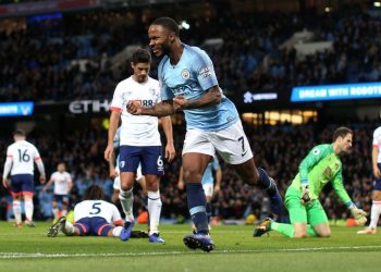 Raheem Sterling wheels away in celebration after scoring Man City’s winning goal against Bournemouth, Saturday