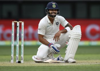 Virat Kohli reacts after diving to make his ground during day two of the second match against Australia at Perth Stadium