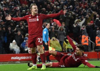 Xherdan Shaqiri (L) celebrates his goal against Manchester United at Anfield, Sunday