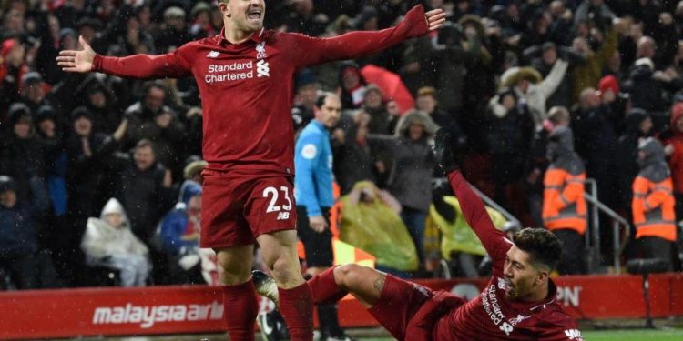 Xherdan Shaqiri (L) celebrates his goal against Manchester United at Anfield, Sunday