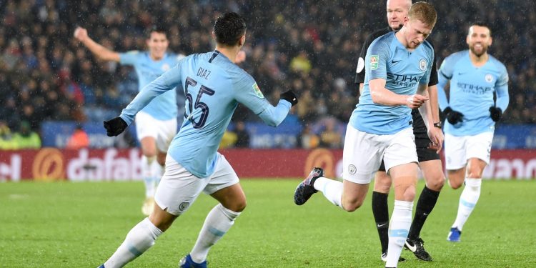 Kevin de Bruyne (R) wheels away in celebration after putting Man City ahead against Leicester City, Tuesday