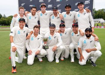 New Zealand players pose with their winners’ trophy at Wellington, Sunday