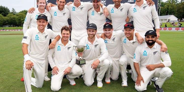 New Zealand players pose with their winners’ trophy at Wellington, Sunday