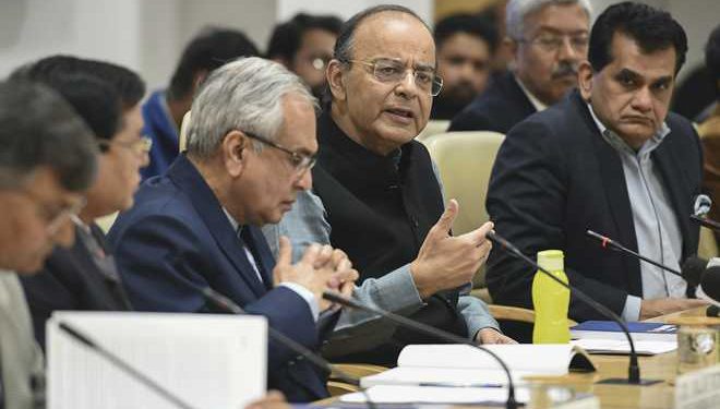 Finance Minister Arun Jaitley flanked by NITI Aayog Vice Chairman Rajiv Kumar and CEO Amitabh Kant (R) addresses a press conference in New Delhi Wednesday