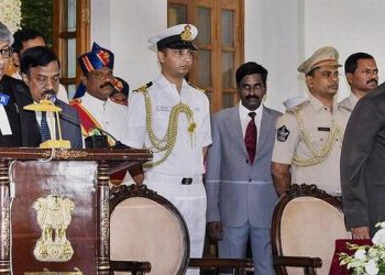 Governor of A.P. and Telangana E.S.L. Narasimhan administering the oath of office to Justice Thottathil Bhaskaran Nair Radhakrishnan