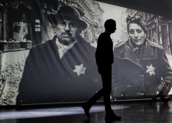 An actor of the Romania's Jewish State Theatre rehearse the musical drama "The Lights of the Ghetto" a mix of music and stories by Holocaust survivors in Bucharest, Romania, Saturday, Jan. 26, 2019, a day before the premiere on International Holocaust Remembrance Day. About 280,000 Romanian Jews and 11,000 Romanian Roma, or Gypsies, were deported and killed during WWII when Romania was ruled by a pro-nazi regime. (AP)