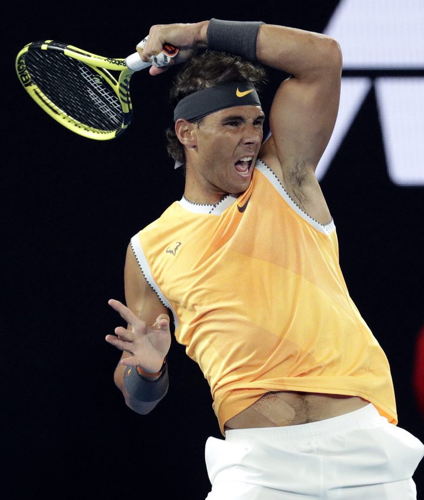 Rafael Nadal makes a forehand return to Frances Tiafoe during their quarterfinal match at the Australian Open in Melbourne, Tuesday