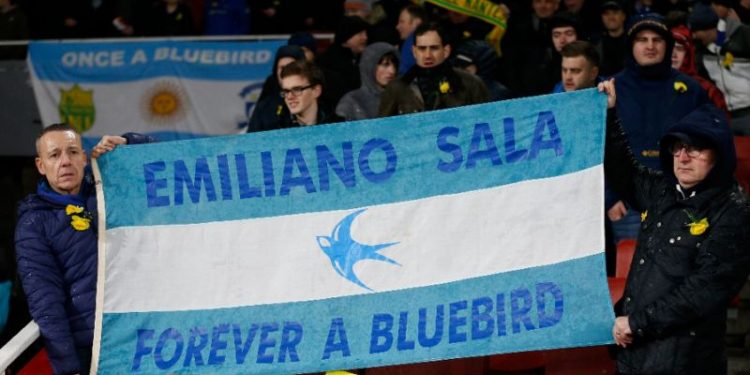Cardiff fans hold up a banner in the colours of the Argentina flag honouring Emiliano Sala (AP)