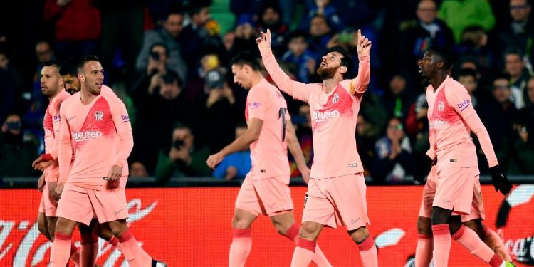 Lionel Messi gestures towards sky after scoring Barcelona’s opener against Getafe in Madrid, Sunday