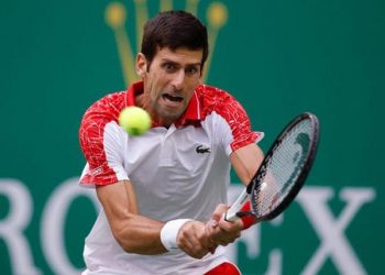 Novak Djokovic plays a shot against Nikoloz Basilashvili in Doha, Thursday