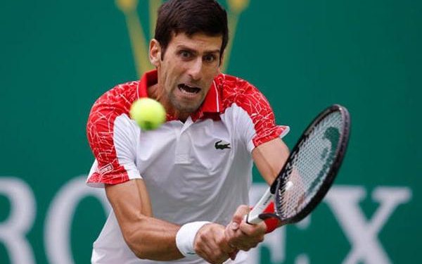 Novak Djokovic plays a shot against Nikoloz Basilashvili in Doha, Thursday