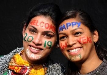 Godspeed 2018 and welcome 2019. People with face paints in Amritsar, on Dec 31, 2018. (IANS)