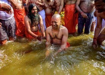 Uttar Pradesh Chief Minister Yogi Adityanath takes a holy dip in the water of River Ganga at Sangam during the ongoing Kumbh Mela-2019, in Allahabad. (PTI)