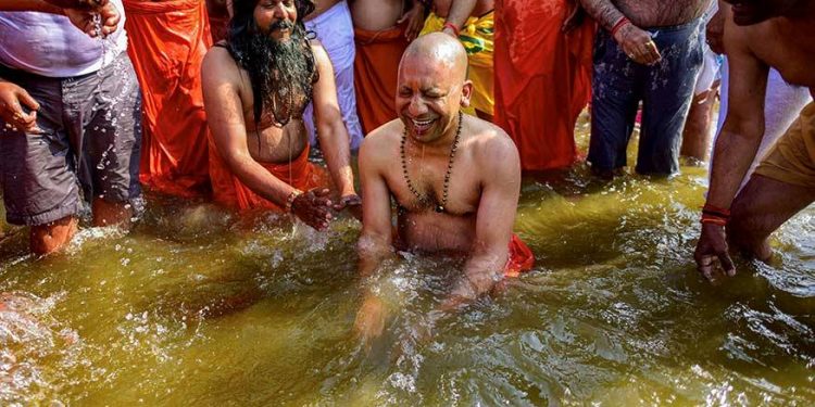 Uttar Pradesh Chief Minister Yogi Adityanath takes a holy dip in the water of River Ganga at Sangam during the ongoing Kumbh Mela-2019, in Allahabad. (PTI)