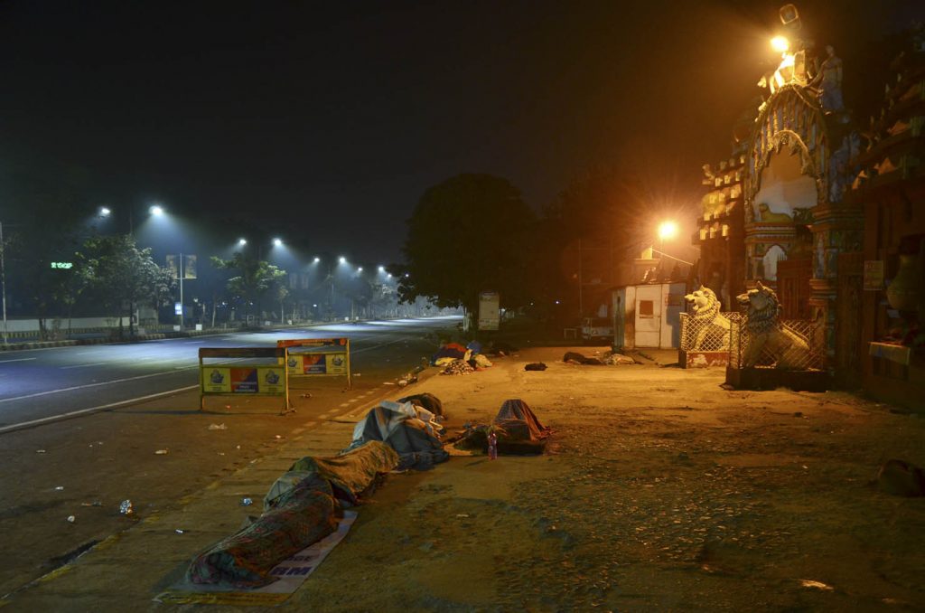 people sleeping on road