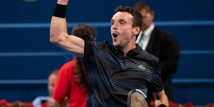 Roberto Bautista Agut reacts after beating Novak Djokovic in Doha, Saturday