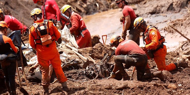 Rescue workers continue their search at the dam disaster side