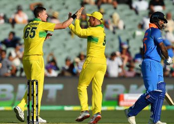 Australians celebrate after the dismissal of Shikhar Dhawan