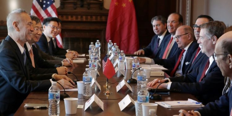 Beijing's trade envoy Liu He (L) meets with US Trade Representative Robert Lighthizer (R) at the Eisenhower Building near the White House (AFP)