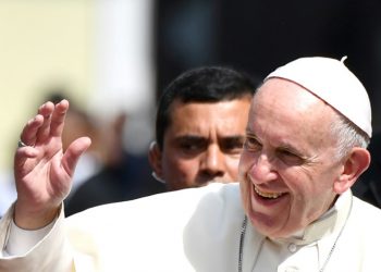 Pope Francis waves after a meeting with Central American bishops in which he blasted "fears and suspicions" over migration