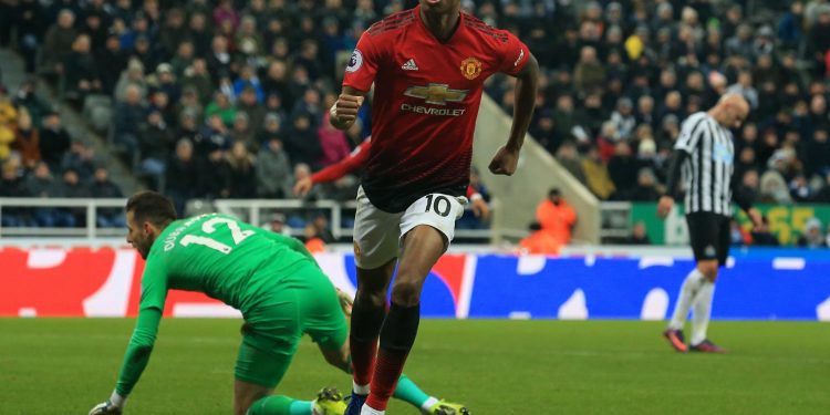 Marcus Rashford wheels away in celebration after scoring Manchester United’s second goal against Newcastle United at St James Park, Wednesday 