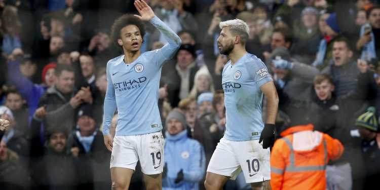 Leroy Sane (L) and Sergio Aguero celebrate after the latter’s goal against Liverpool at Etihad Stadium, Thursday