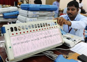 Polling officials pasting candidates list along with photos and party symbols in Electronic Voting Machines(EVM) at distribution centre at NKT National Girls Higher Secondary School  in Chennai for Tamil Nadu Assembly elections.10-05-2016 (PTI)