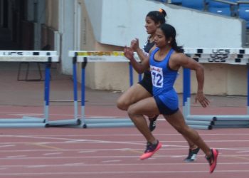 Dutee Chand (in blue) sprints during the women’s 200m event in New Delhi, Wednesday