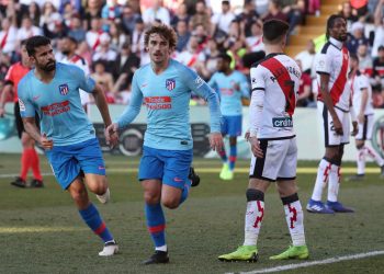 Antoine Griezmann (centre) celebrates after scoring against Rayo Vallecano as Diego Costa (left) runs to join him