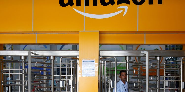 An employee of Amazon walks through a turnstile gate inside an Amazon Fulfillment Centre (BLR7) on the outskirts of Bengaluru, India, September 18, 2018. (REUTERS)