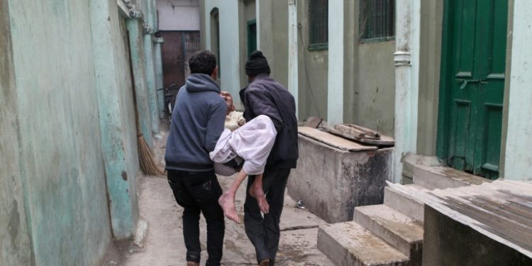 Some 20 men and women each month come to India from around the world to finish their days at Varanasi's 'Death Hotel', a tired old red colonial-era building with 12 sparse concrete floor rooms (AFP)