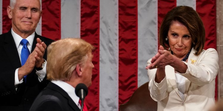 President Donald Trump turns to House speaker Nancy Pelosi of Calif., as he delivers his State of the Union address to a joint session of Congress on Capitol Hill in Washington, as Vice President Mike Pence watches, Tuesday, Feb. 5, 2019. (AP)