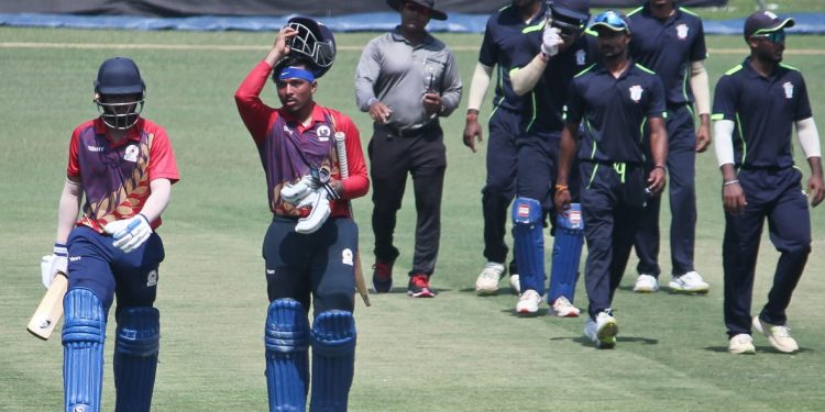 Chhattisgarh openers Rishabh Tiwari (R) and Shashank Chandrakar walk off the Barabati Stadium greens after leading their team to a 10-wicket victory over Odisha, Thursday