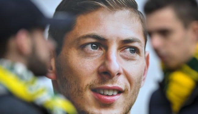 FC Nantes supporters stand beside a portrait of Argentinian striker Emiliano Sala. (AFP)