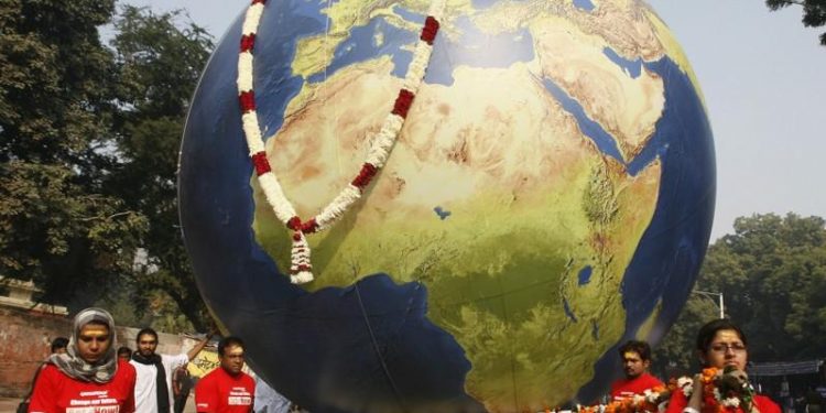 Greenpeace activists carry a model of the earth during a mock funeral procession in New Delhi December 21, 2009. (REUTERS)