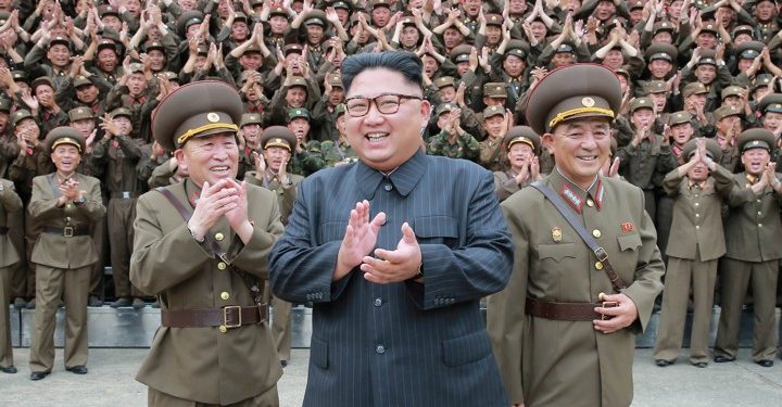 North Korean leader Kim Jong Un claps with military officers at the Command of the Strategic Force of the Korean People's Army (KPA) in an unknown location in North Korea