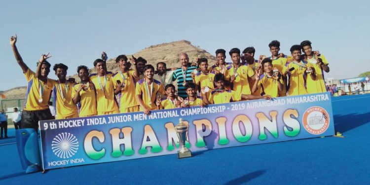 Triumphant Hockey Odisha players pose with the winners’ trophy, Thursday      