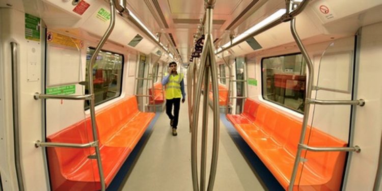 A passenger walks the cabin of a Delhi metro [Representational Image] (PTI)