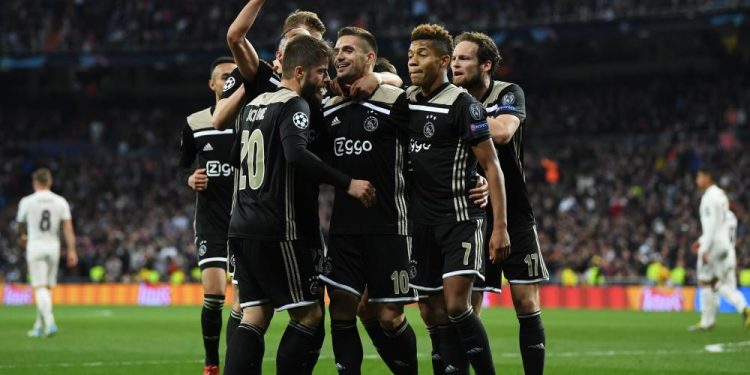 Dusan Tadic (No.10) is congratulated by teammates after scoring Ajax’s third goal in their Champions League encounter against Real Madrid, Tuesday