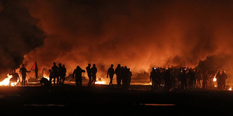 Palestinians in Gaza had thrown a number of explosive devices toward the border fence with Israel, one of which set off air raid sirens in the south of the country late Saturday.