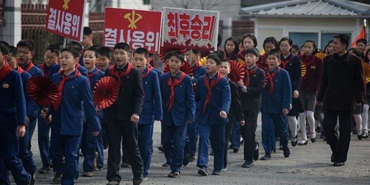 Children march to encourage voters to cast their ballots during voting for the Supreme People’s Assembly elections, in Pyongyang 10 March 2019 (AFP)