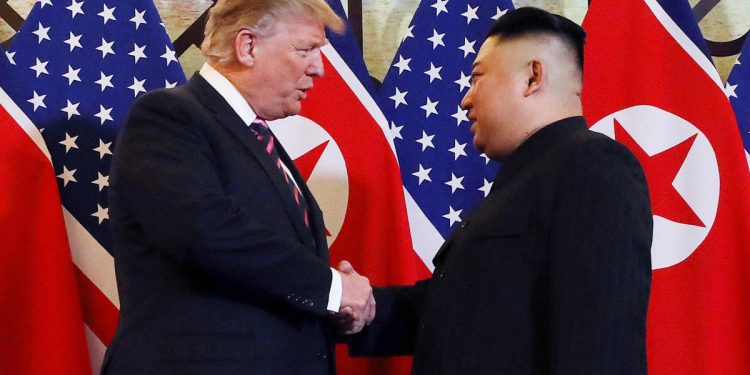 President Donald Trump and North Korean leader Kim Jong Un shake hands to start their summit in Hanoi, Vietnam, February 27