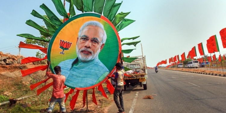 Party workers during preparation for Modi visit. (PTI)