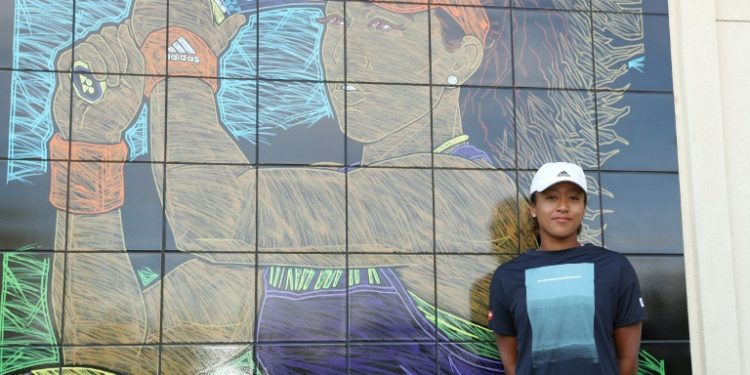 Naomi Osaka unveils a mural with her likeness at the BNP Paribas Open in Indian Wells (AFP)