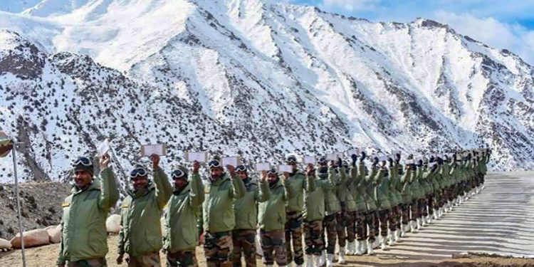 Siachen: Army soldiers queue up to cast their votes for the Lok Sabha elections as a Service voters, in Siachen, Thursday, April 11, 2019. In a first-of-its-kind the Election Commission of India provided the facility to the troops deployed in far flung, remote and inhospitable terrain to download their ballot papers online, vote and forward the ballot papers to their respective Electoral Returning Officers through post. (PTI Photo) (PTI4_11_2019_000302B)