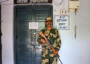 Ajmer: A security jawan guards outside a strongroom where EVMs are kept, at a distribution centre, on the eve of the 4th phase of Lok Sabha elections in Ajmer, Sunday, April 28, 2019. (PTI Photo)    (PTI4_28_2019_000061B) *** Local Caption ***